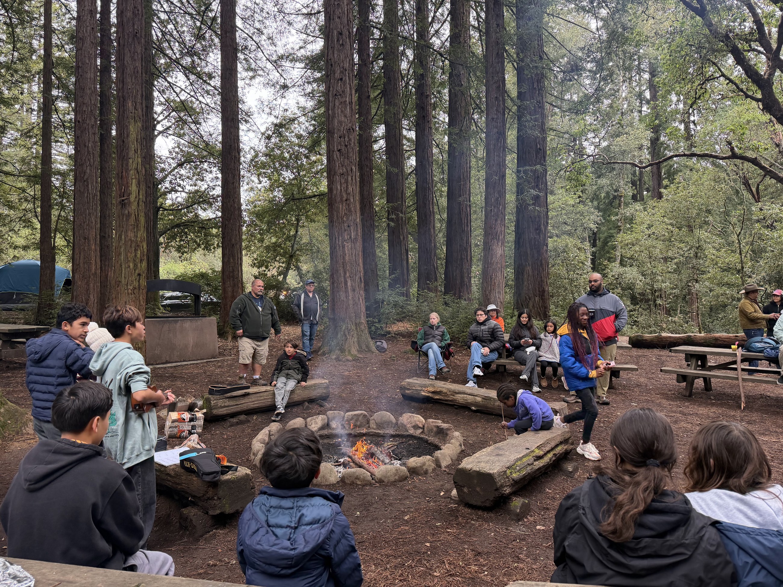 Adventurer families around a campfire